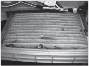 Figure 9: With the glove box open and extended downward, the Prius cabin air filter slides right out. Toyota recommends replacement every 30,000 miles.